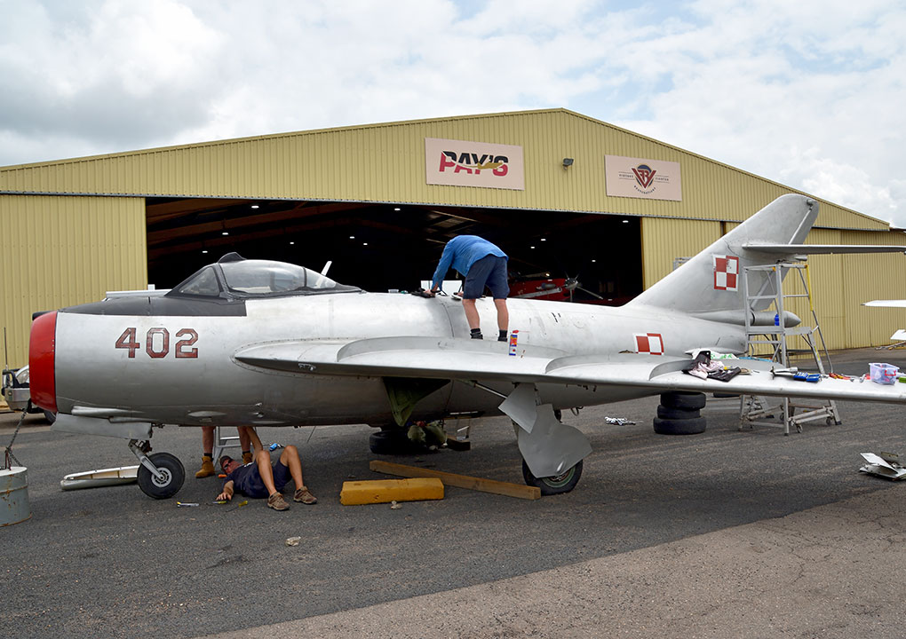 Hunter Fighter Collection volunteers work on re-assembly of the MiG-17F at Scone NSW