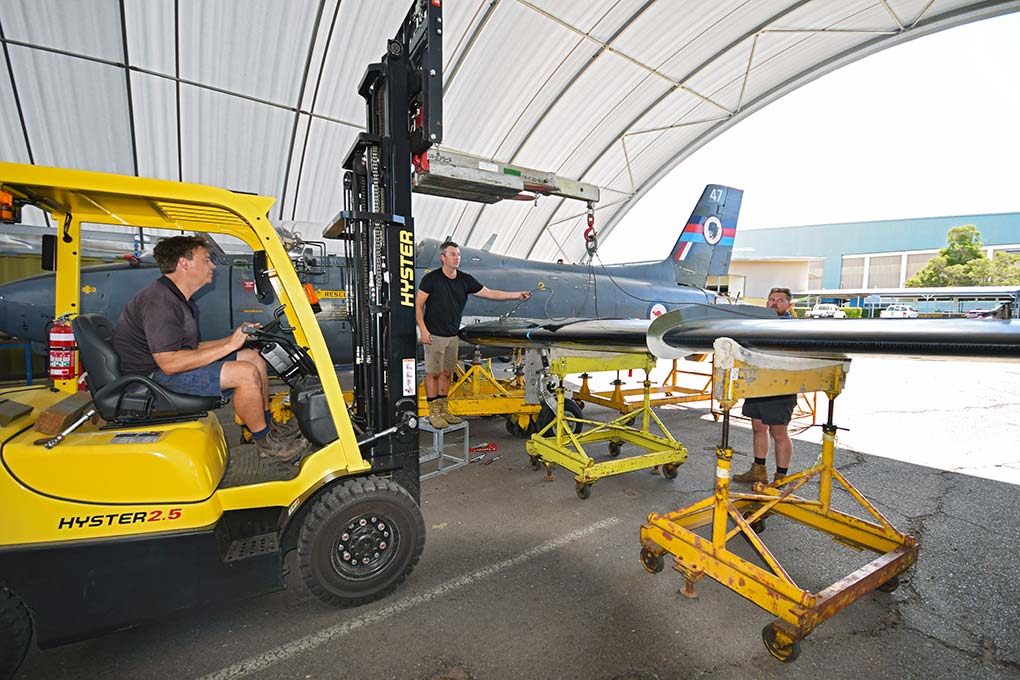 Hunter Fighter Collection Volunteers dismantle Macchi MB-326 at RAAF Base Amberley