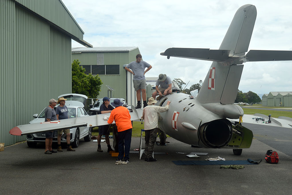 Hunter Fighter Collection volunteers dismantling MiG-17F for transport to Scone