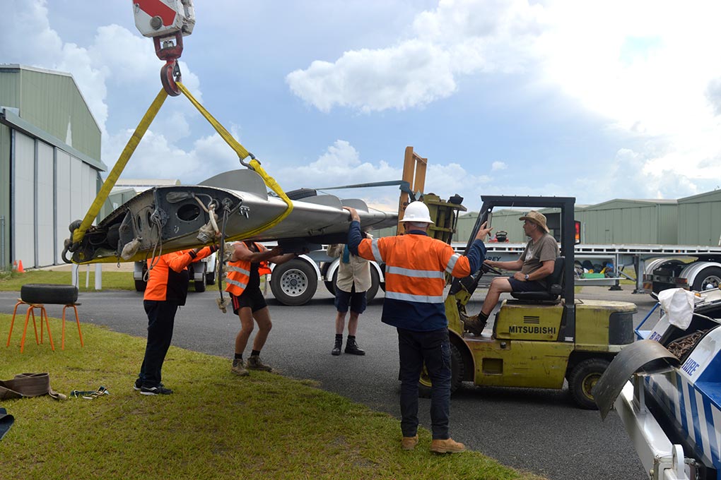 Hunter Fighter Collection volunteers moving MiG-17F wing